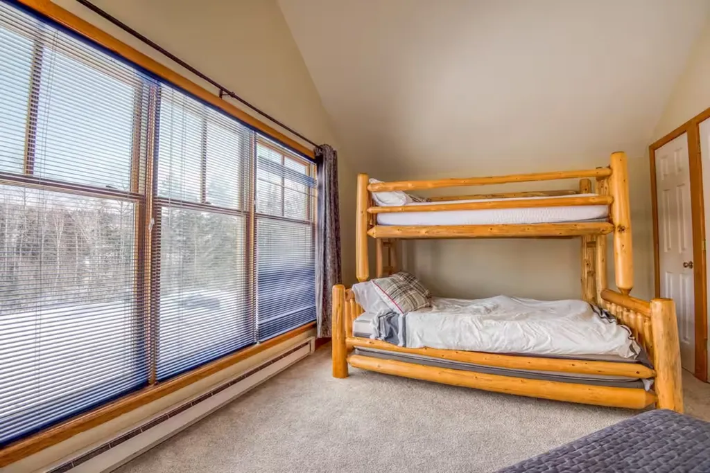 Bunk room with woodland windows